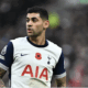 Cristian Romero in Tottenham white, with an Atlético Madrid red and white backdrop, symbolizing his potential transfer target status